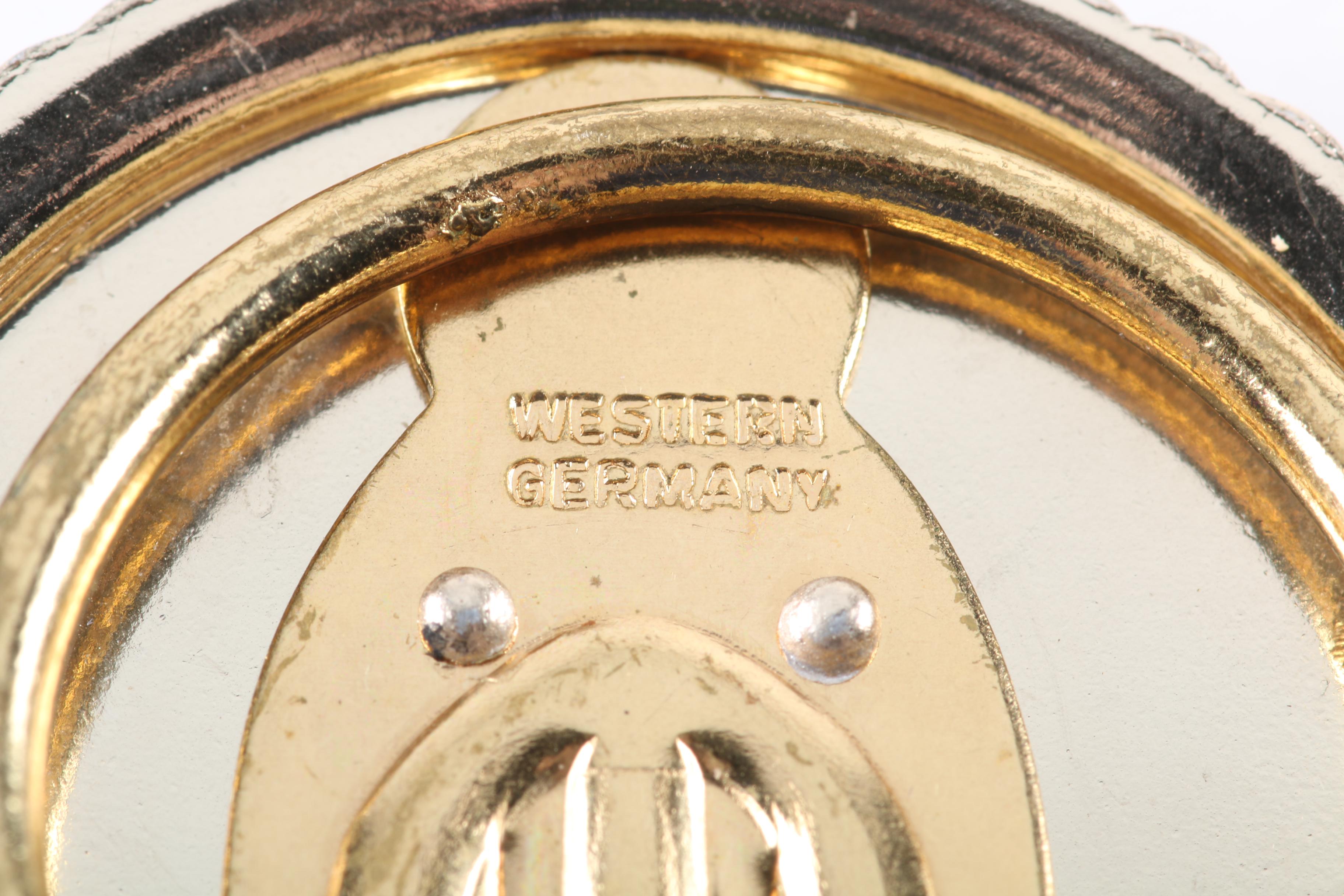 Floral Inspired Brooches, Rings, and Earrings