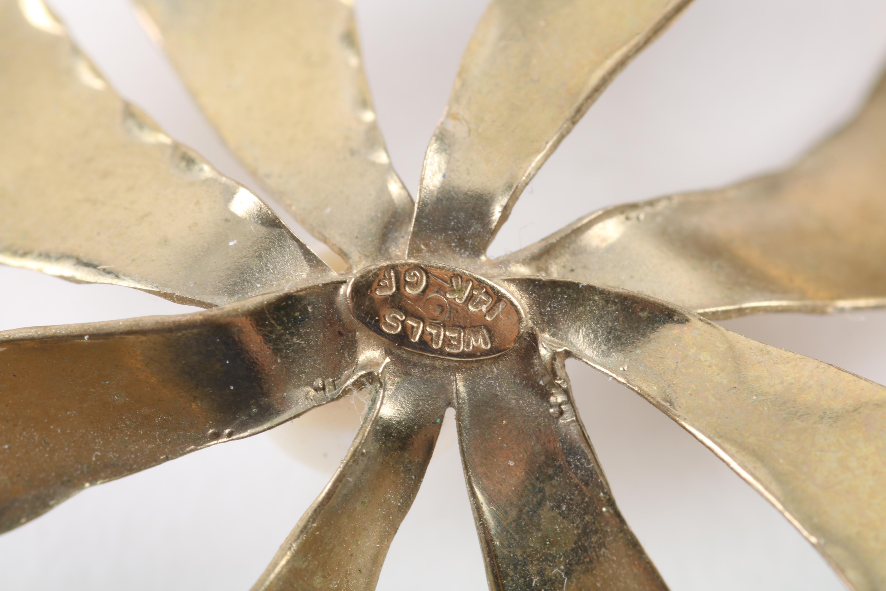 Floral Inspired Brooches, Rings, and Earrings