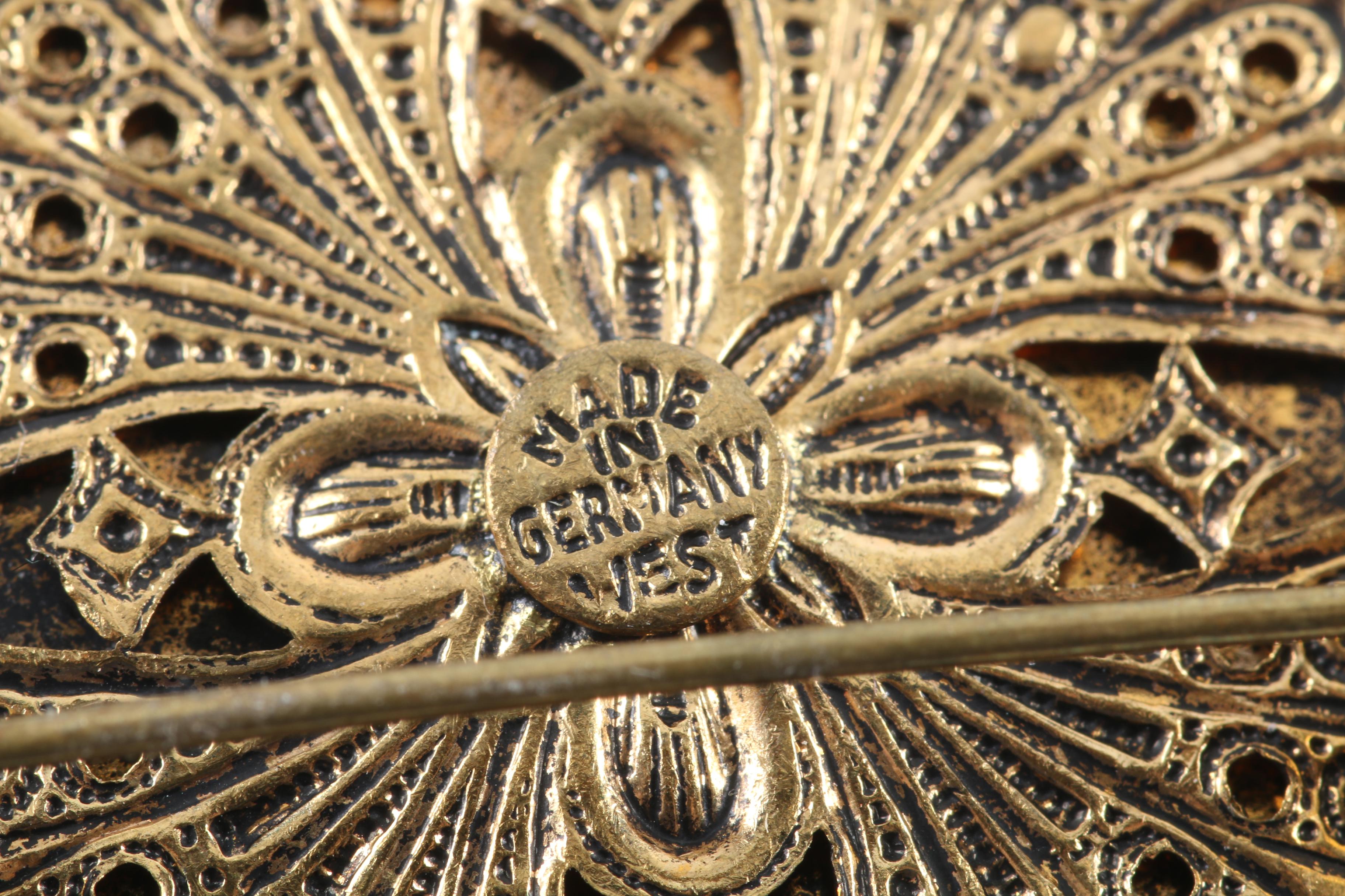 Floral Inspired Brooches, Rings, and Earrings