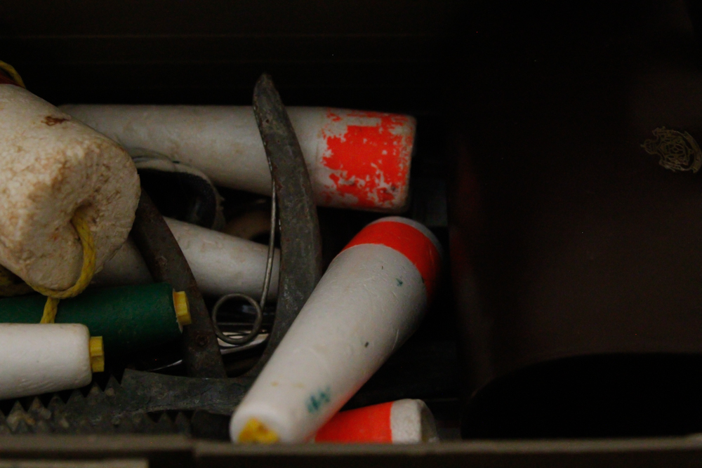 Assorted Fishing Supplies in Tackle Box