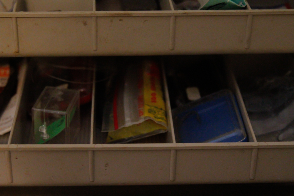 Assorted Fishing Supplies in Tackle Box