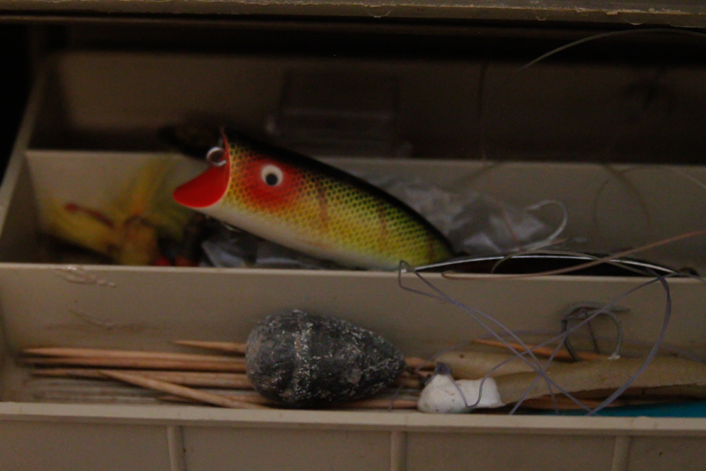 Assorted Fishing Supplies in Tackle Box