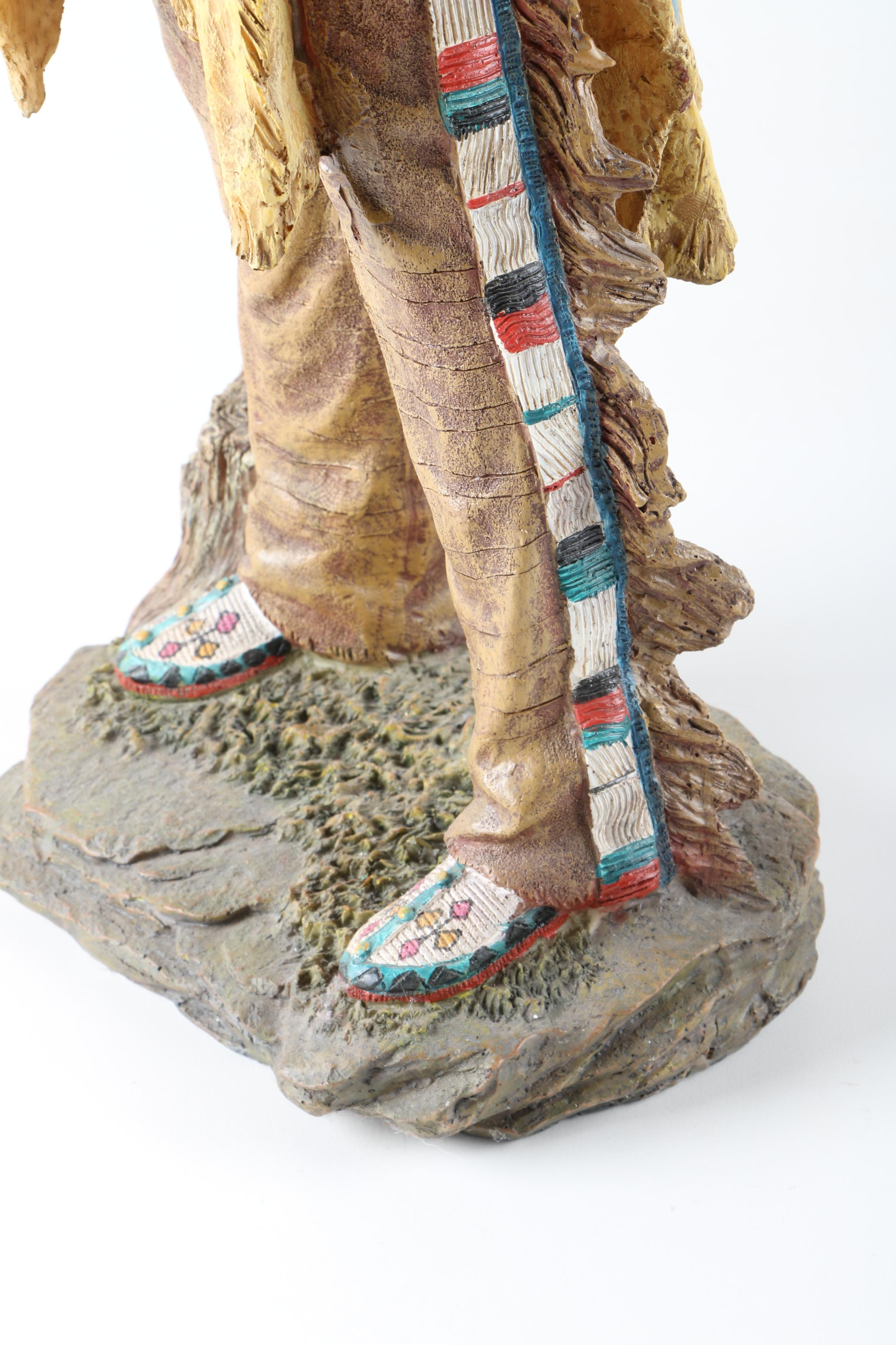 Resin Sculpture of a Native American Man Holding Up a Steer Skull