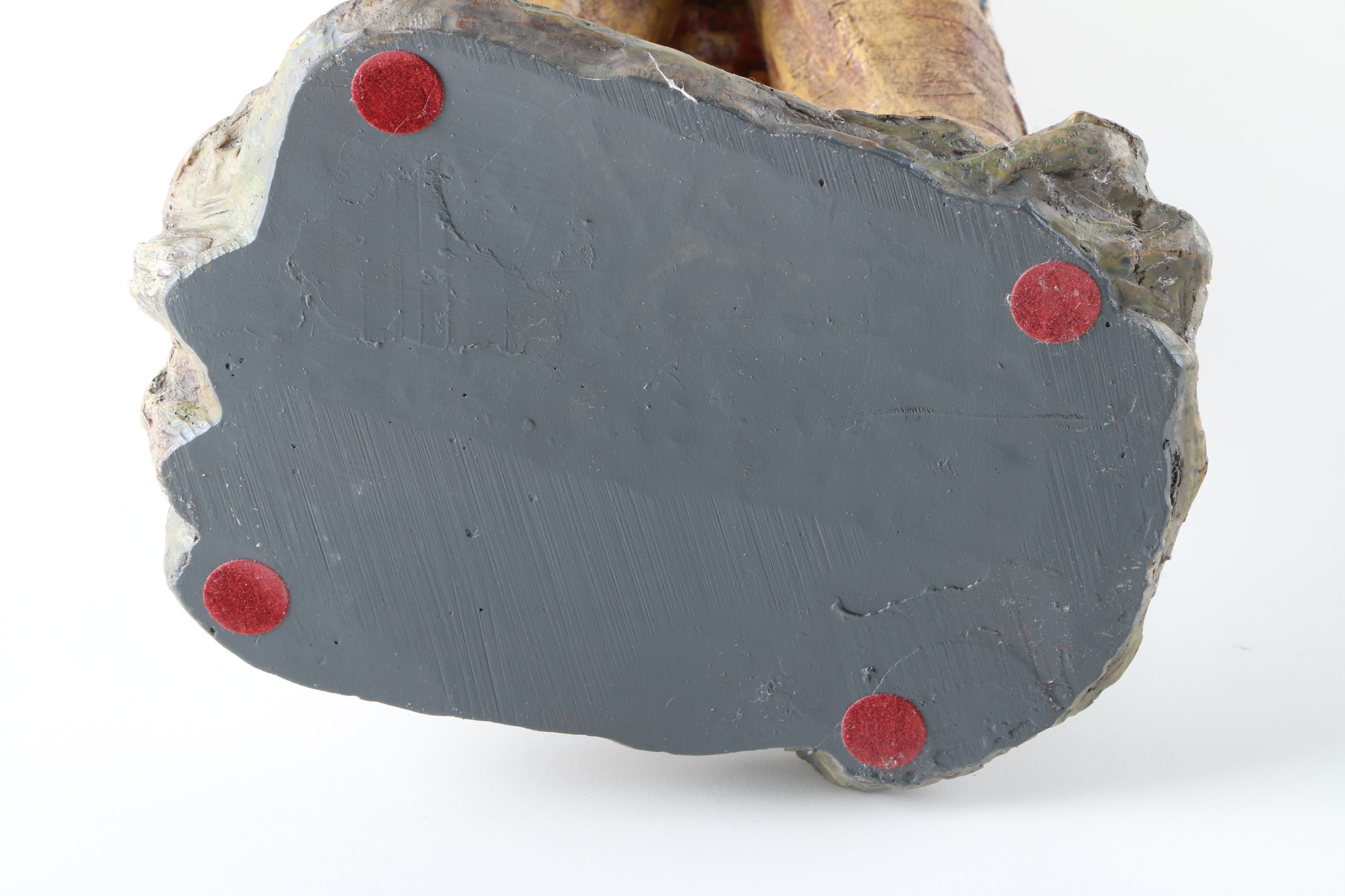 Resin Sculpture of a Native American Man Holding Up a Steer Skull