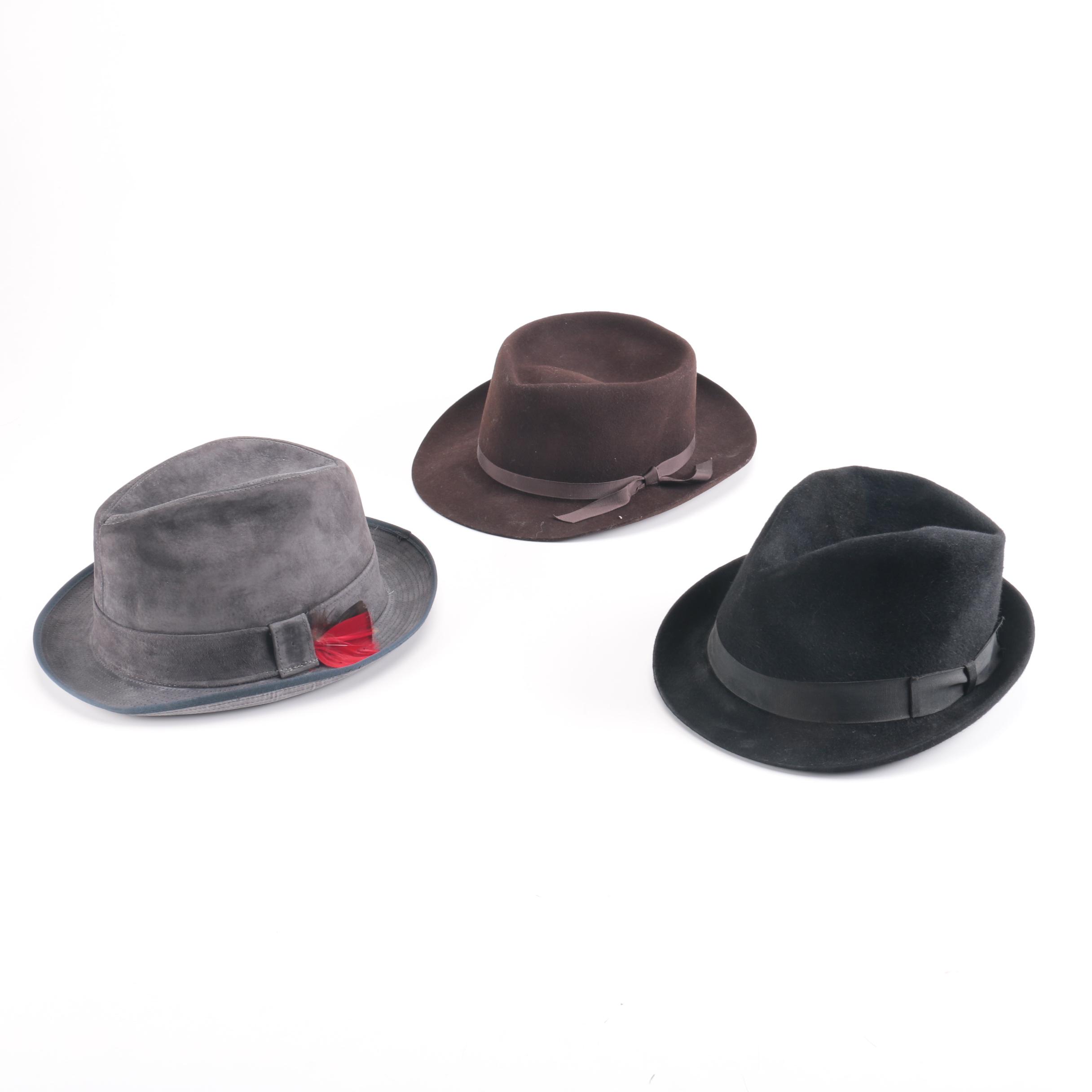 Three Black, Brown, And Gray Suede Fedoras