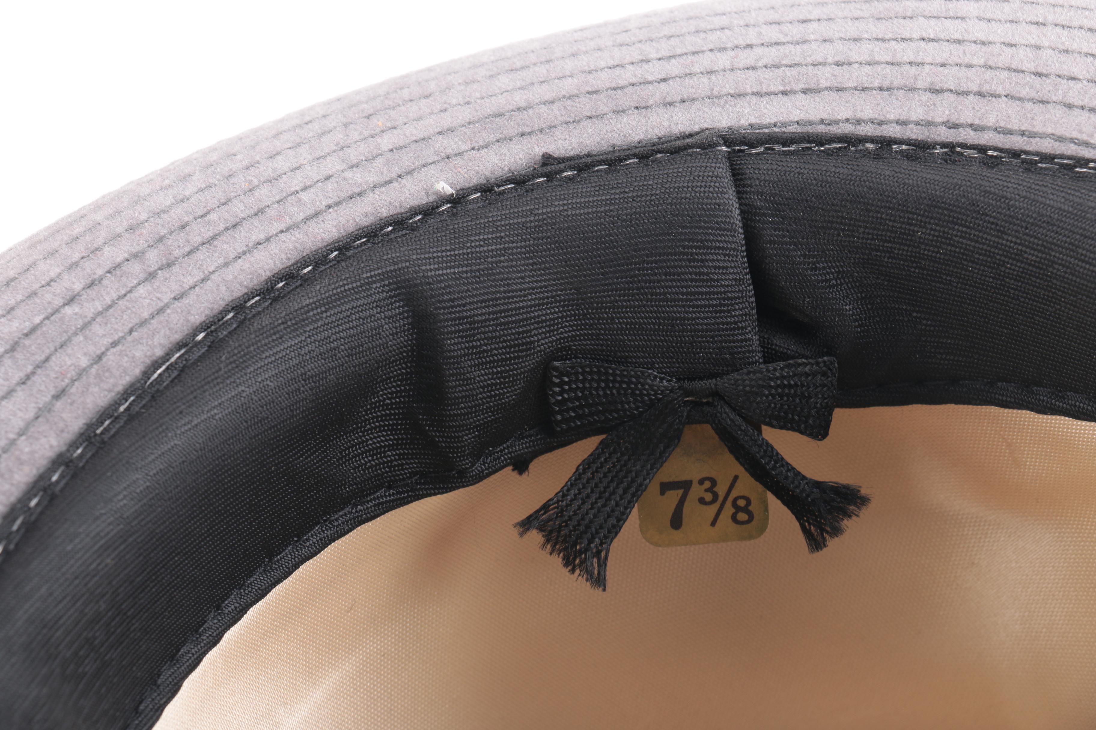 Three Black, Brown, And Gray Suede Fedoras