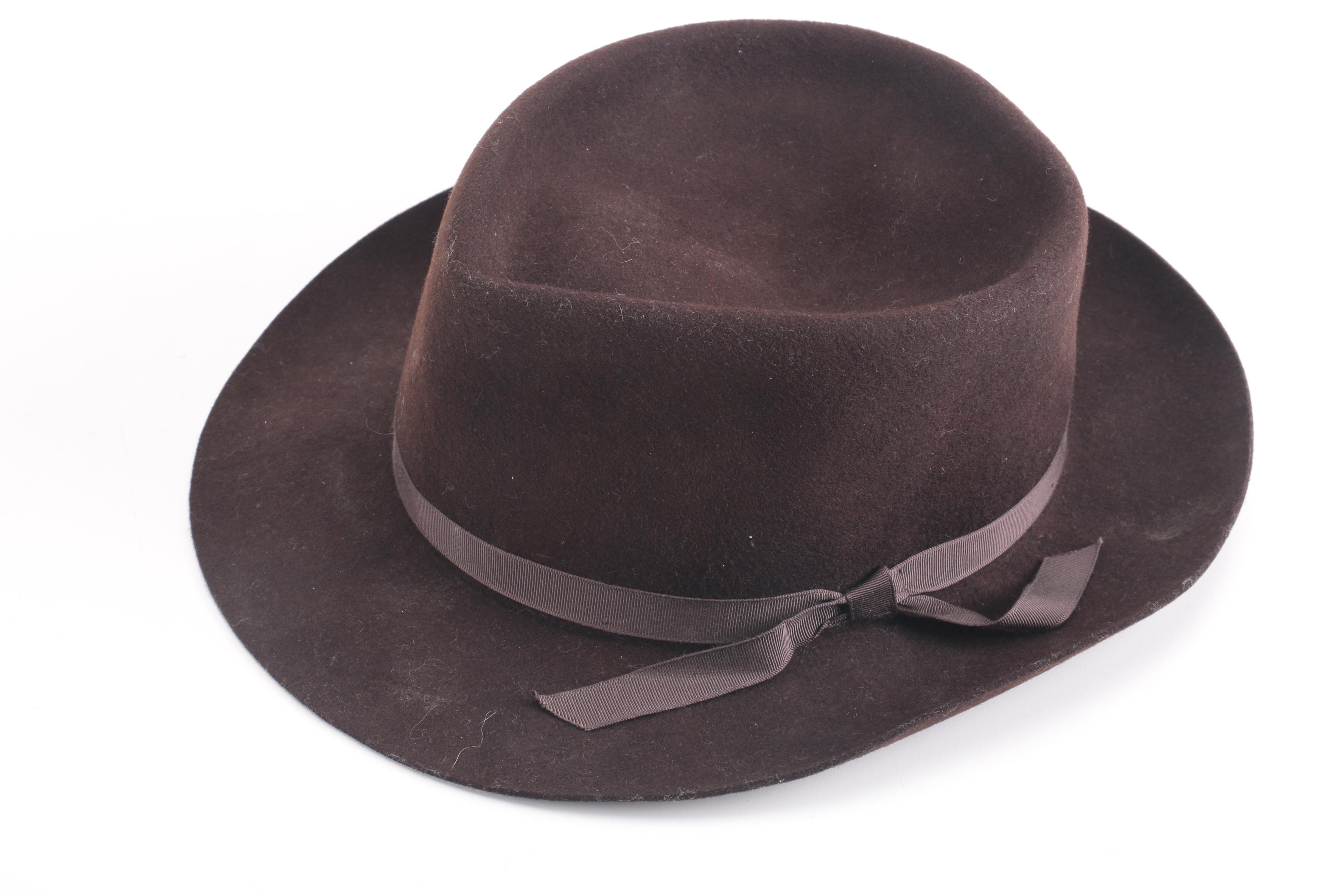 Three Black, Brown, And Gray Suede Fedoras