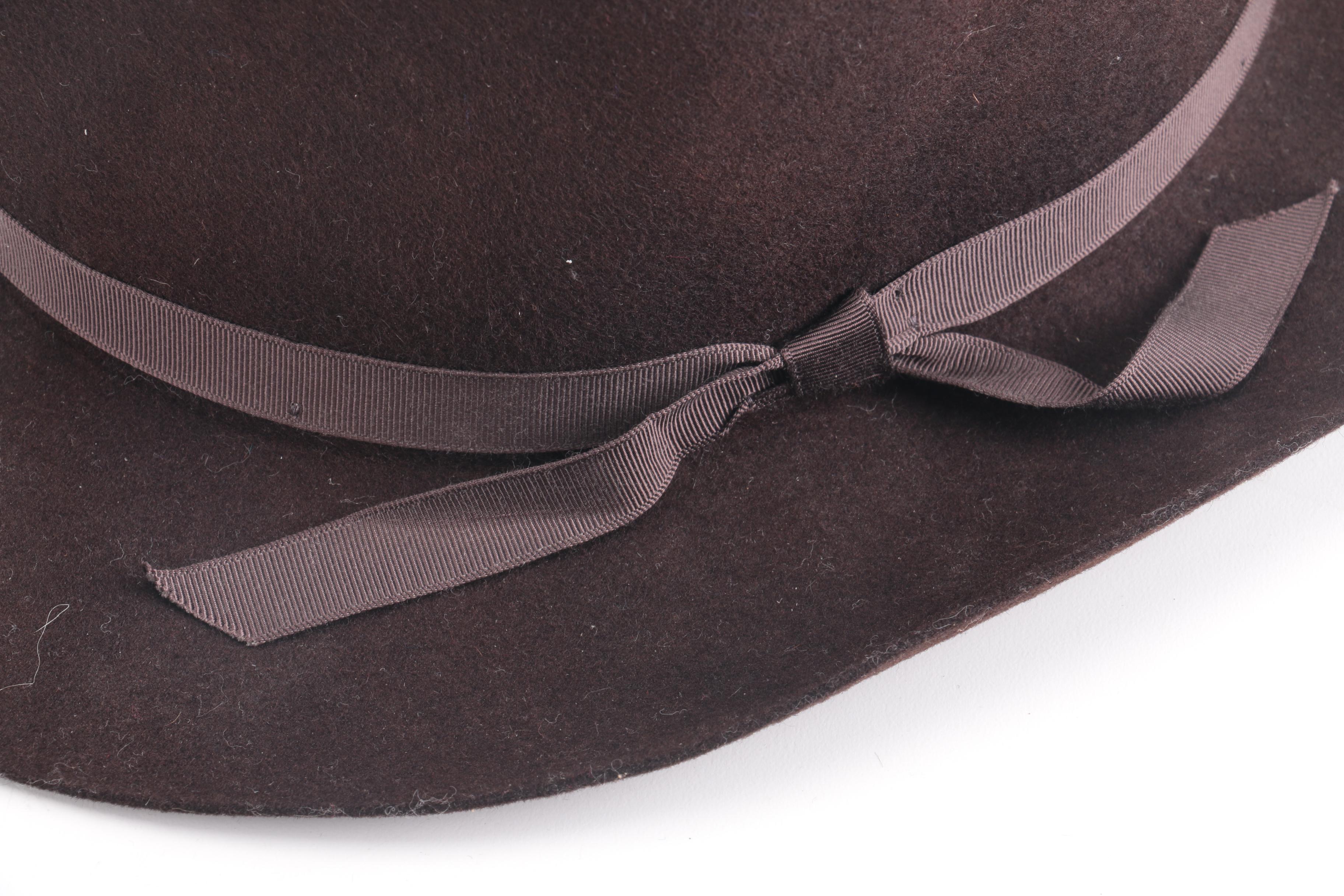 Three Black, Brown, And Gray Suede Fedoras