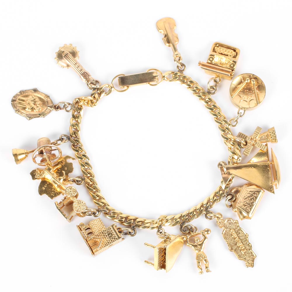 Yellow Gold Bracelet with Fifteen Charms
