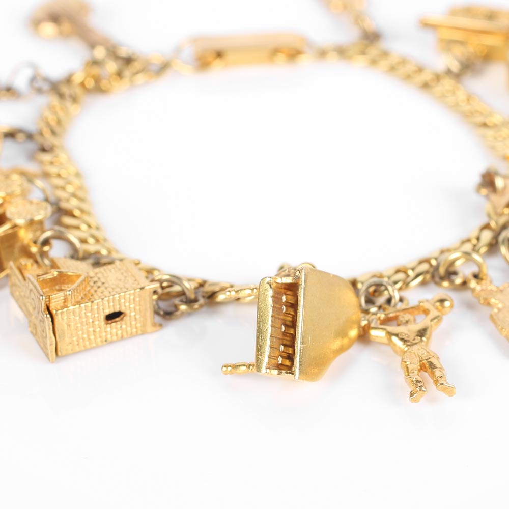 Yellow Gold Bracelet with Fifteen Charms