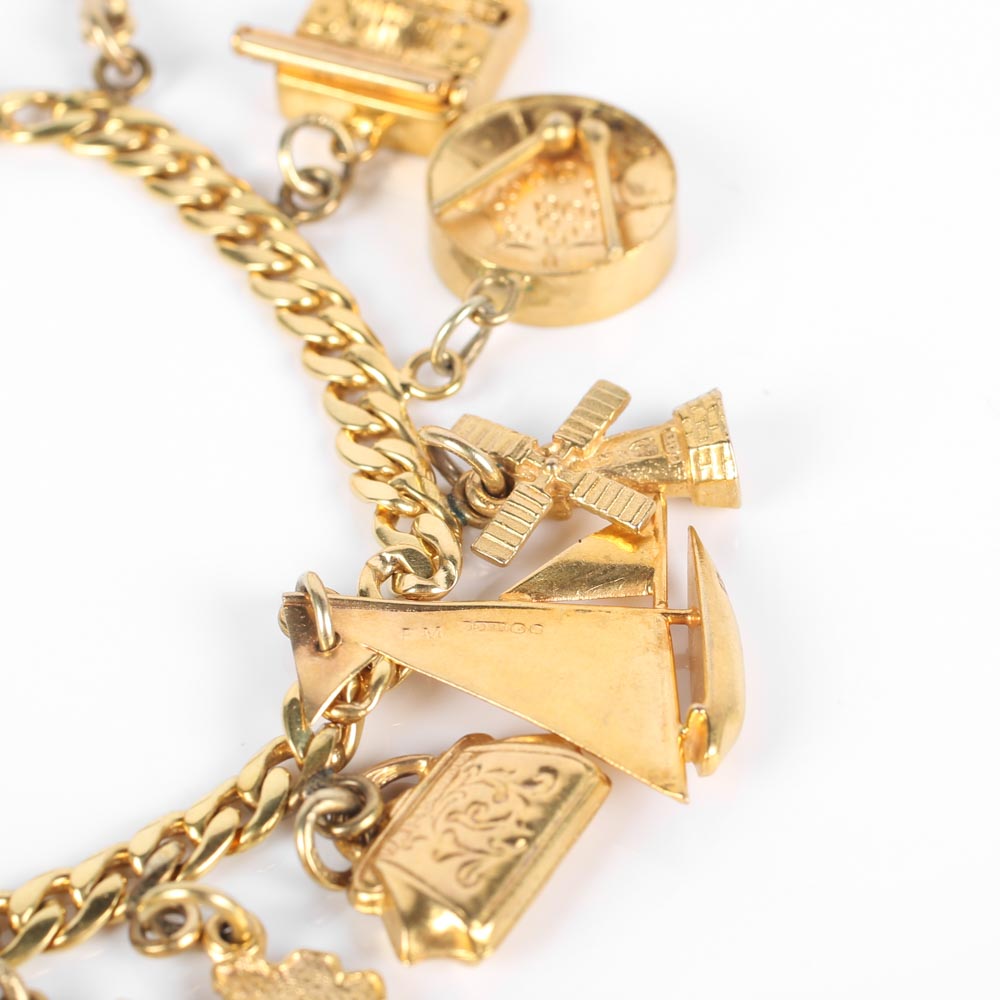 Yellow Gold Bracelet with Fifteen Charms