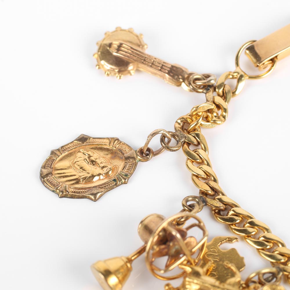 Yellow Gold Bracelet with Fifteen Charms