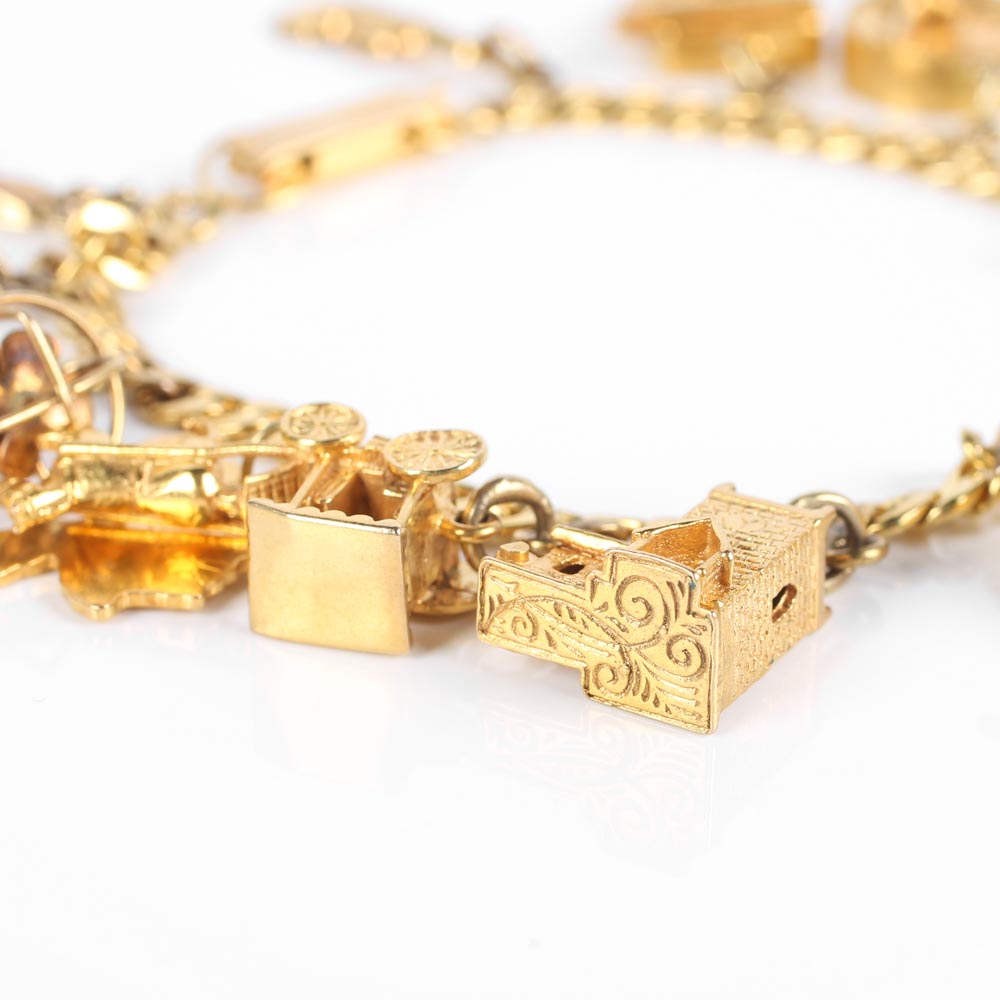 Yellow Gold Bracelet with Fifteen Charms