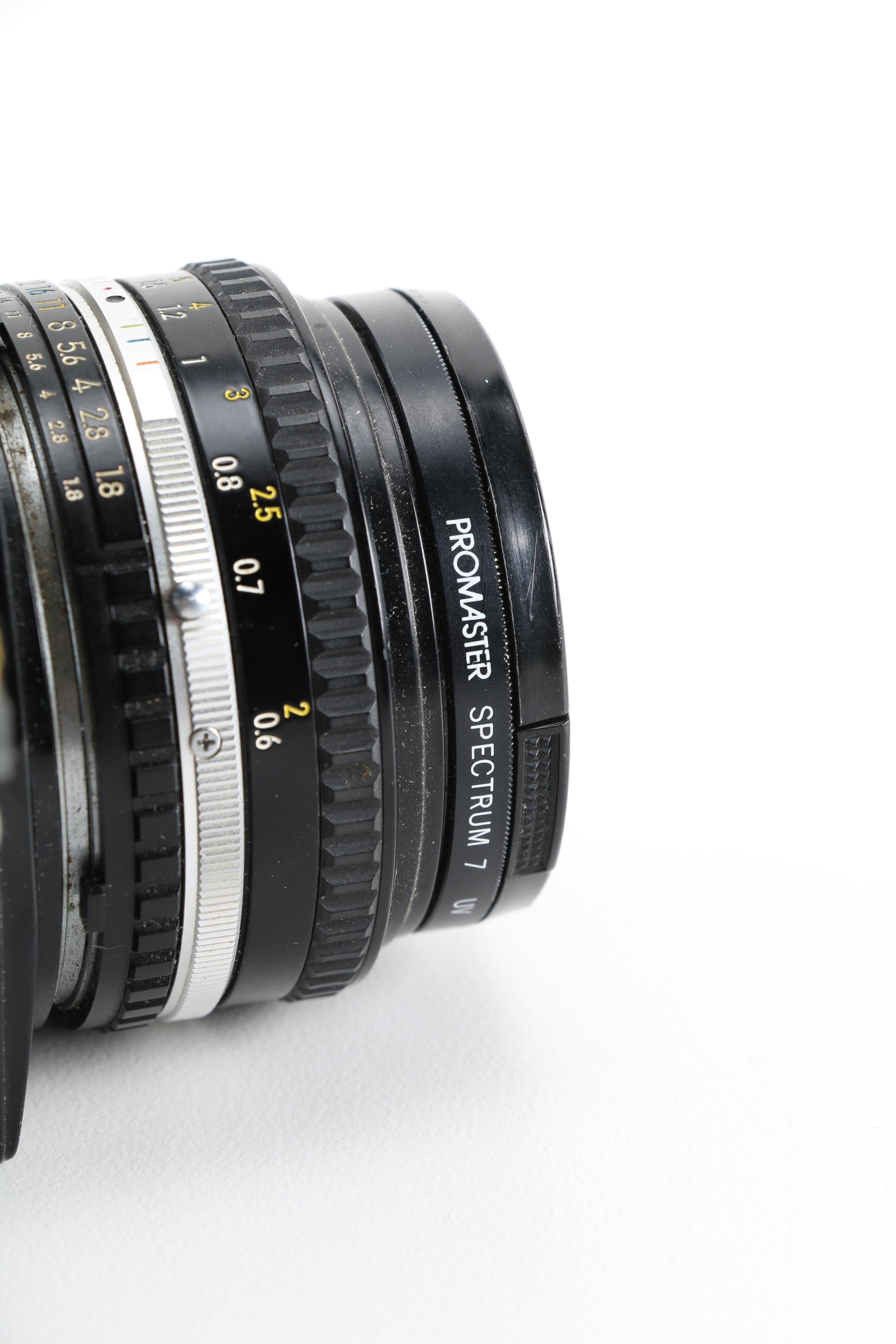 1980s Nikon EM 35mm Camera With Lens and Flash