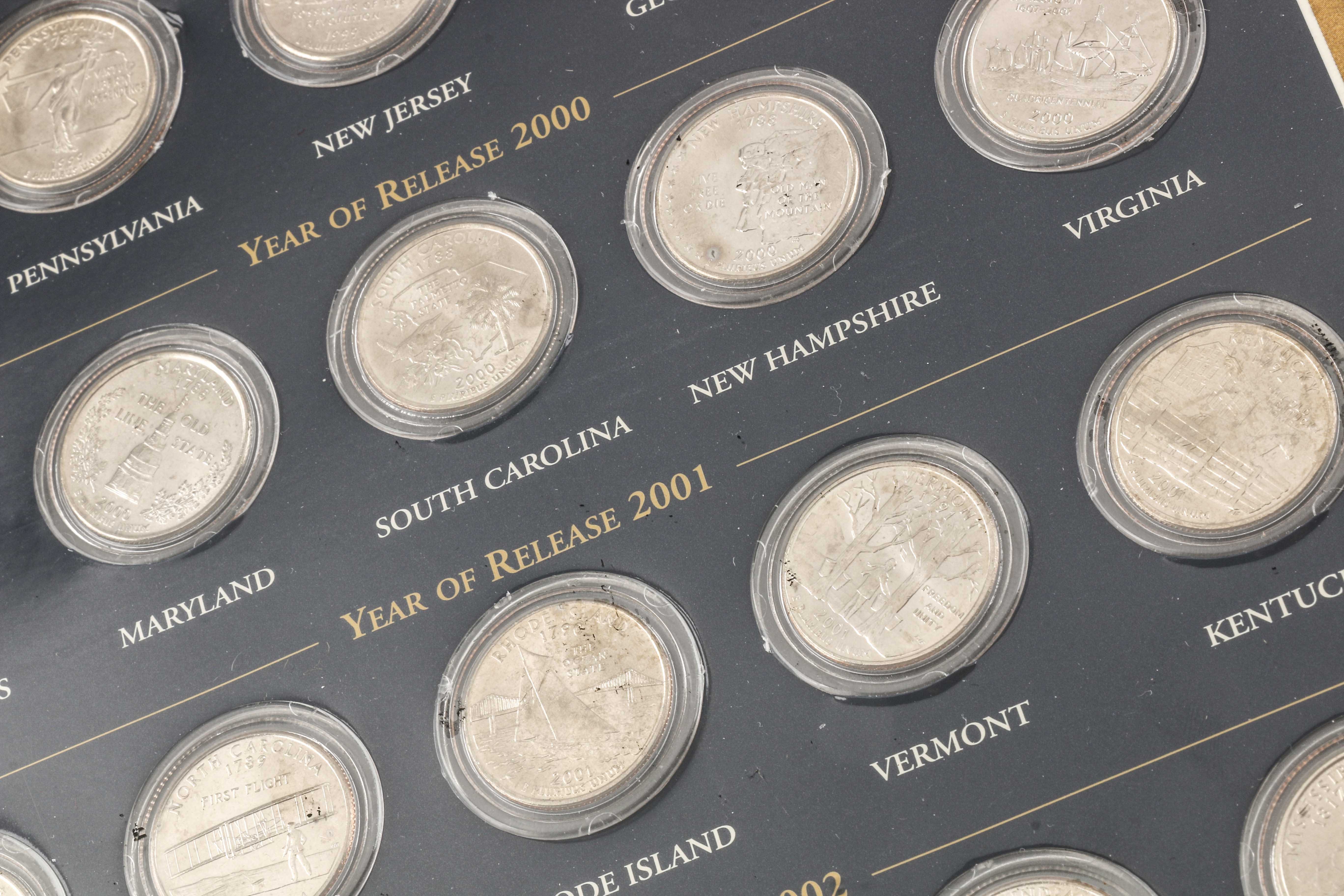 Binder of 100 U.S. Statehood Quarters