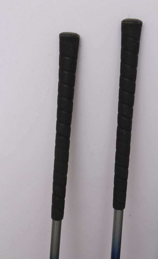 Assortment of Golf Clubs and Accessories