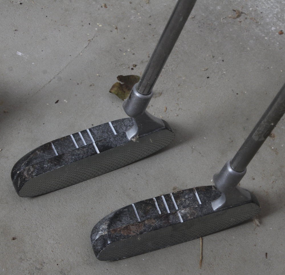 Assortment of Golf Clubs and Accessories