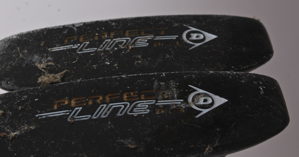 Assortment of Golf Clubs and Accessories