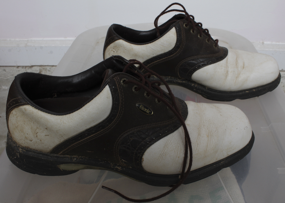 Assortment of Golf Clubs and Accessories