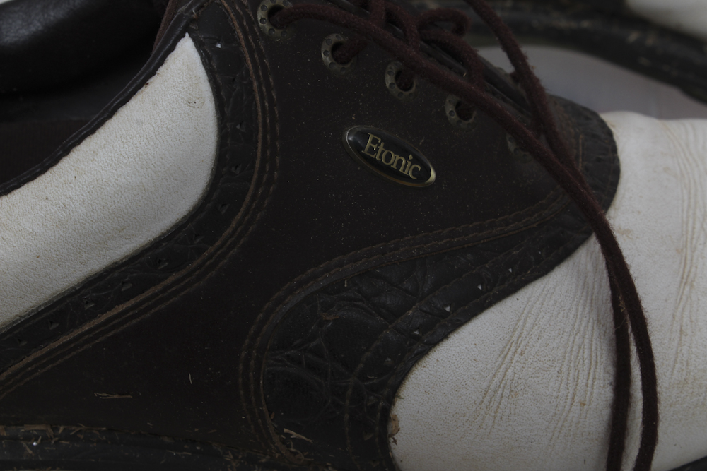 Assortment of Golf Clubs and Accessories