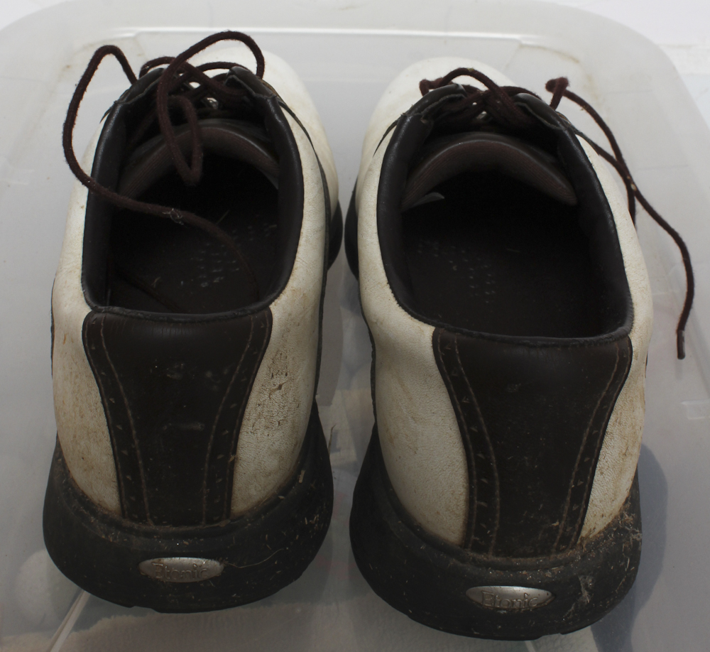 Assortment of Golf Clubs and Accessories