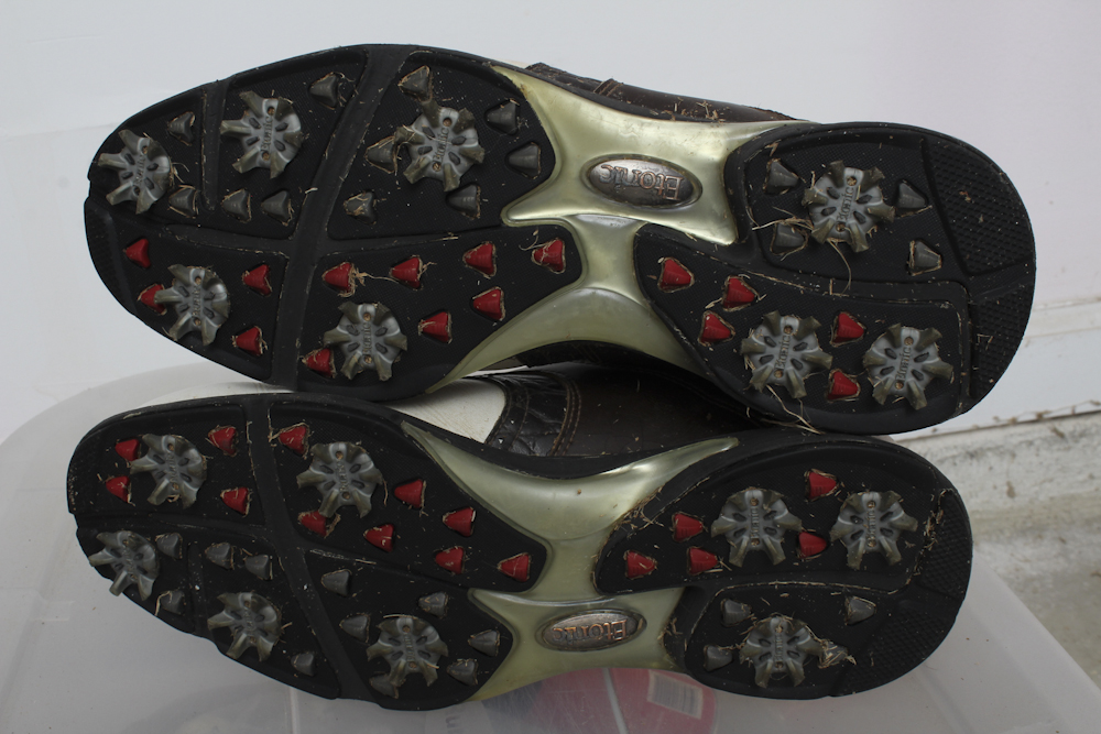 Assortment of Golf Clubs and Accessories