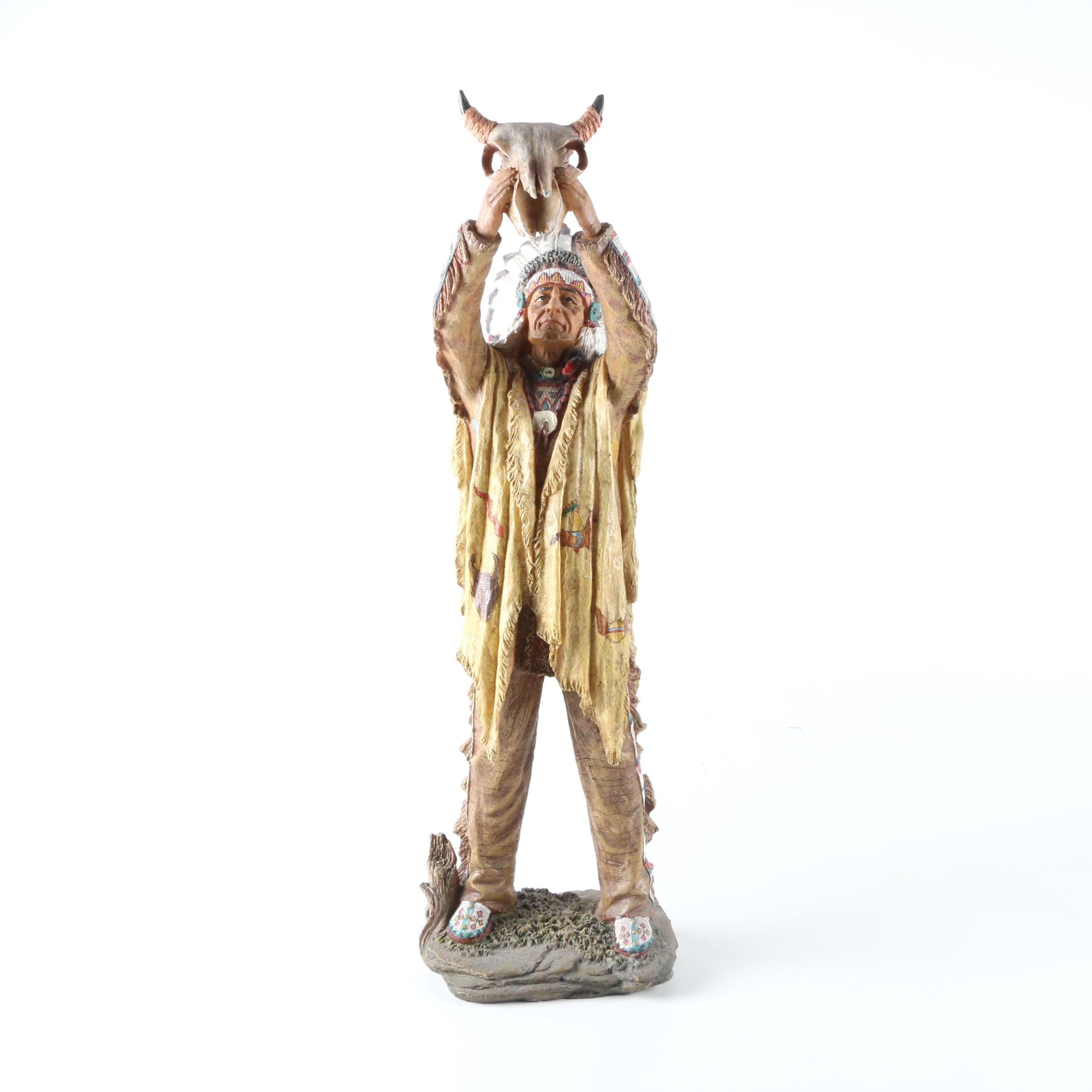 Resin Sculpture of a Native American Man Holding Up a Steer Skull