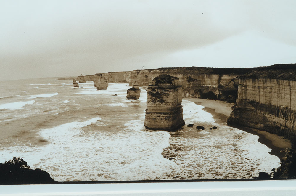 Two Mike Coombe Signed Photographs "Harvey Bay" & "The Twelve Apostles"