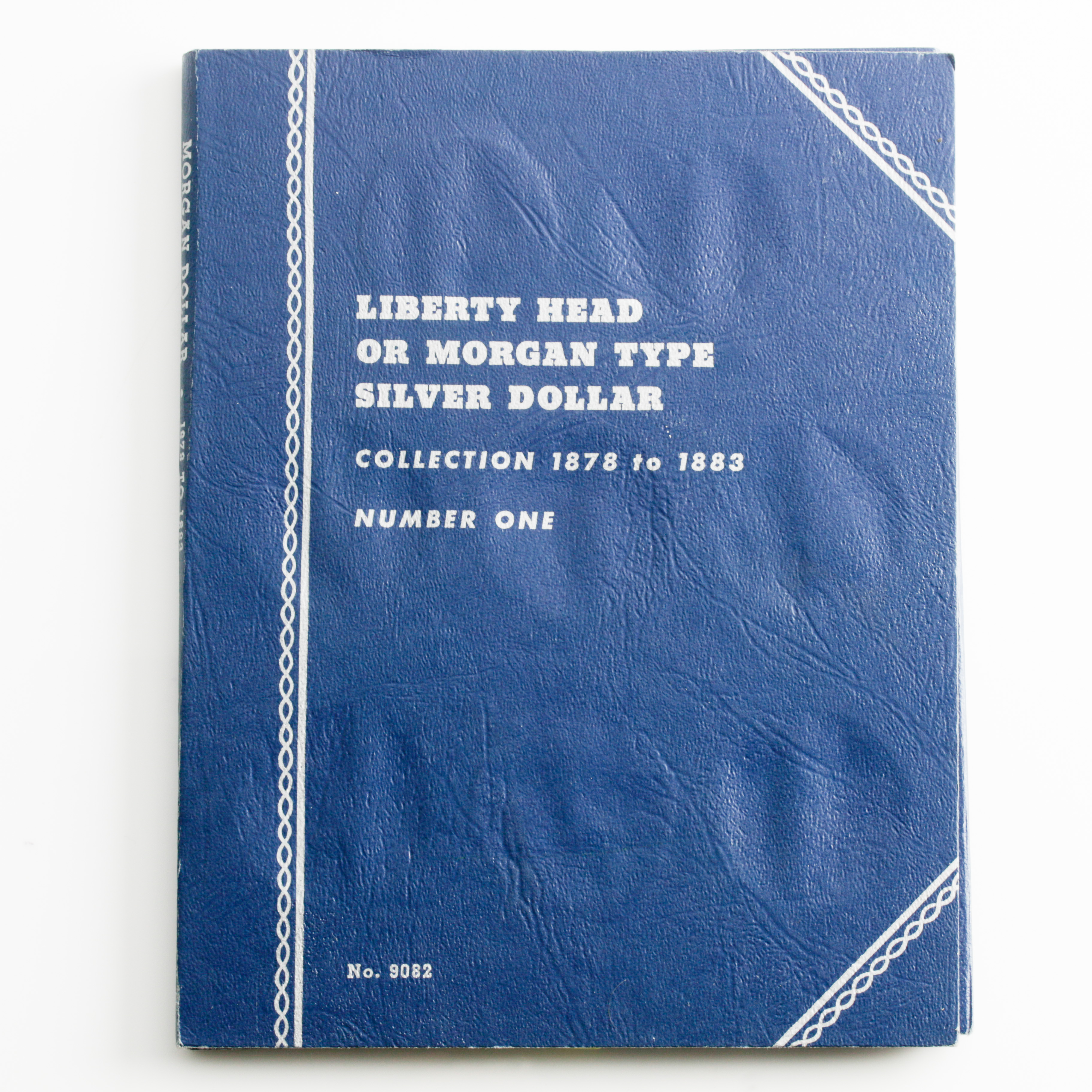 Group of 12 Silver Morgan Dollars in a Whitman Coin Folder Ranging in Age from 1878 to 1883