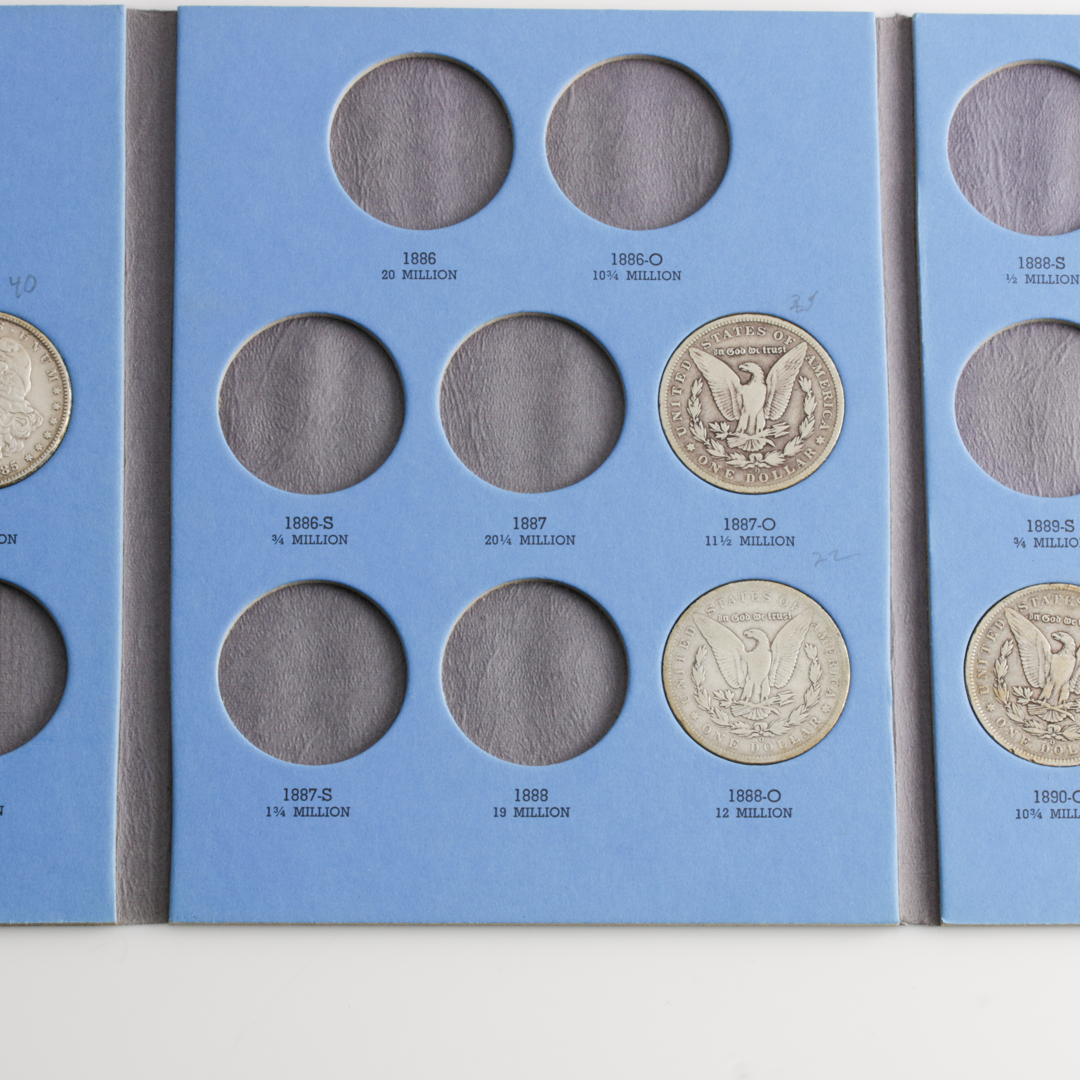 Group of 9 Silver Morgan Dollars in a Whitman Coin Folder Ranging in Age from 1884 to 1890