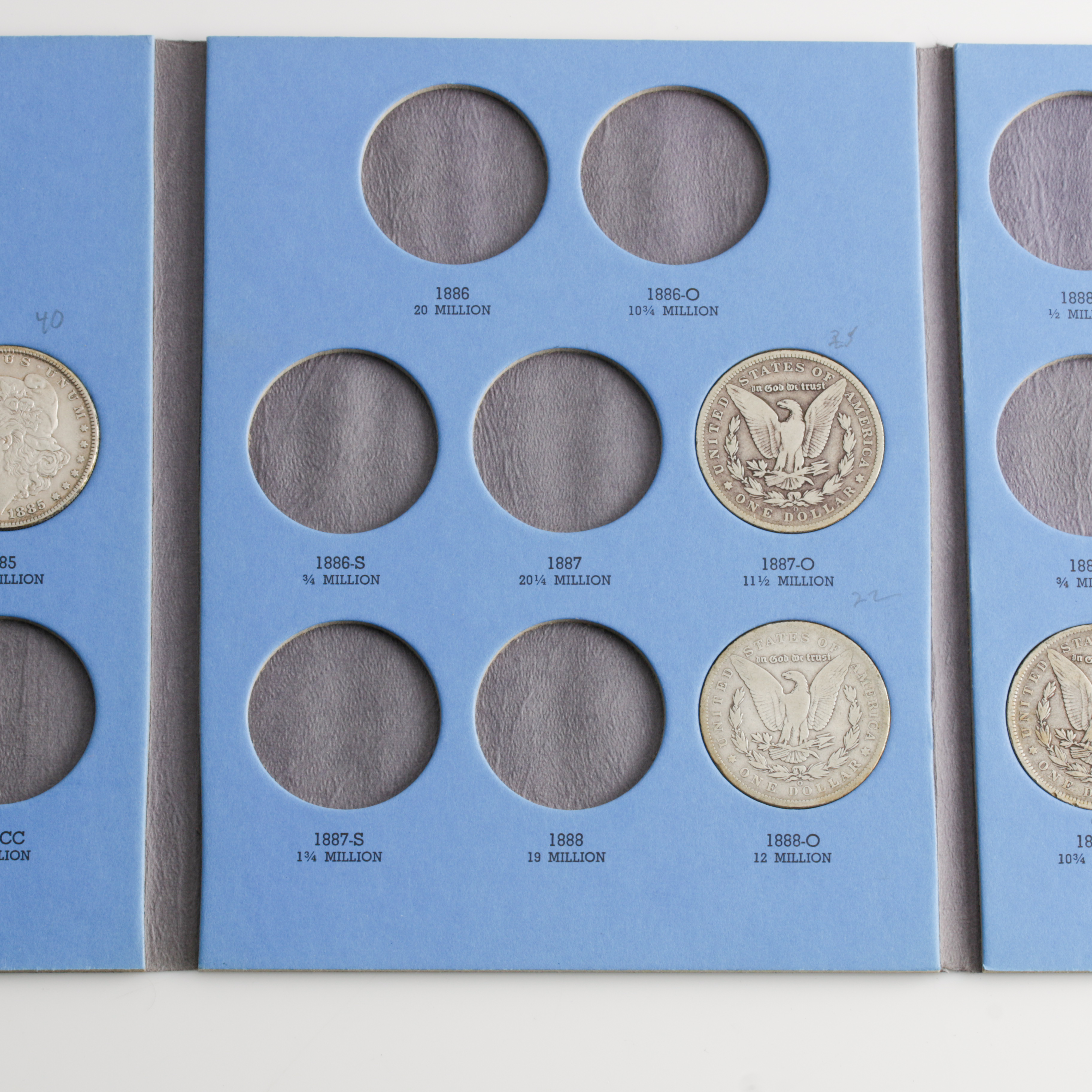 Group of 9 Silver Morgan Dollars in a Whitman Coin Folder Ranging in Age from 1884 to 1890