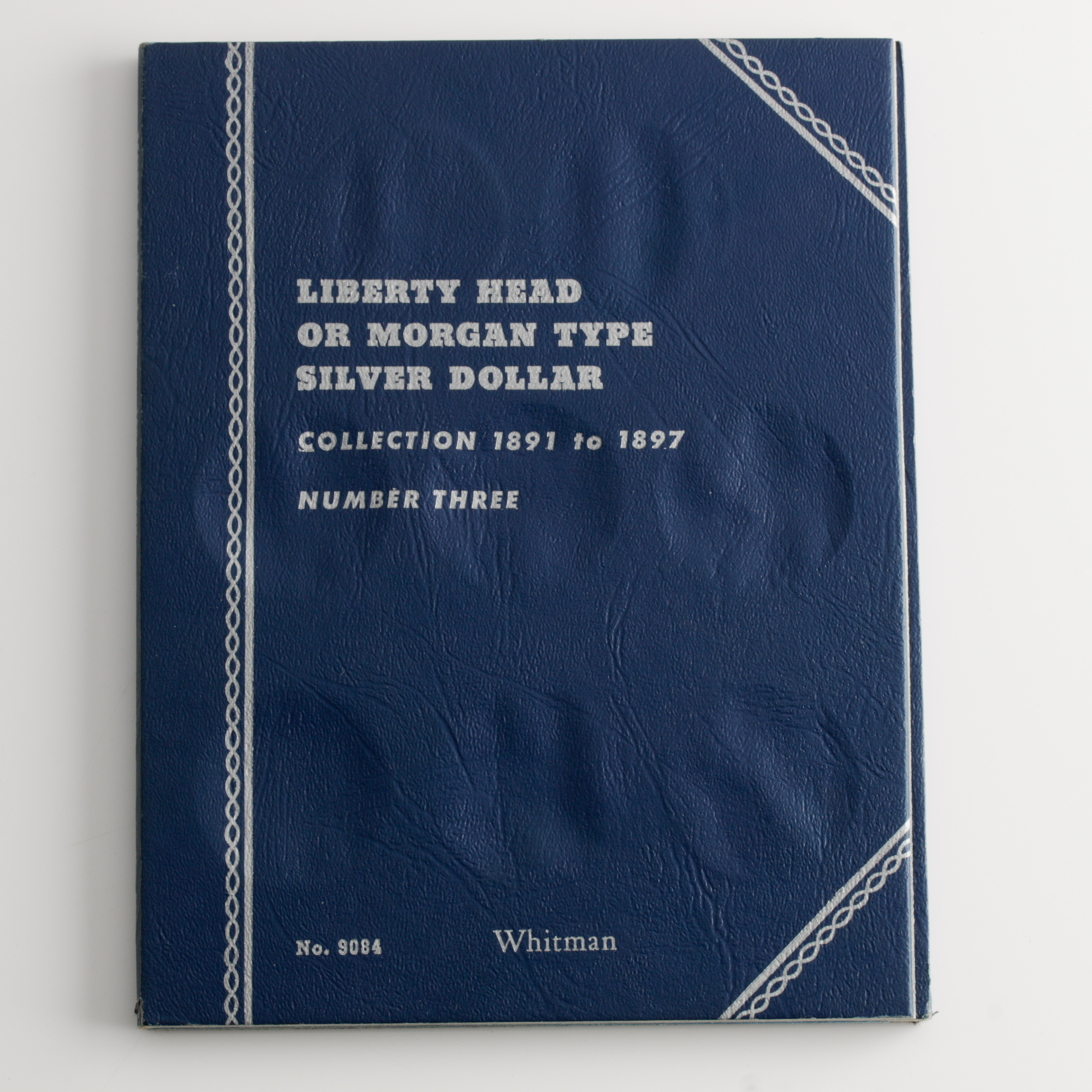 Group of 4 Silver Morgan Dollars in a Whitman Coin Folder Ranging in Age from 1891 to 1896