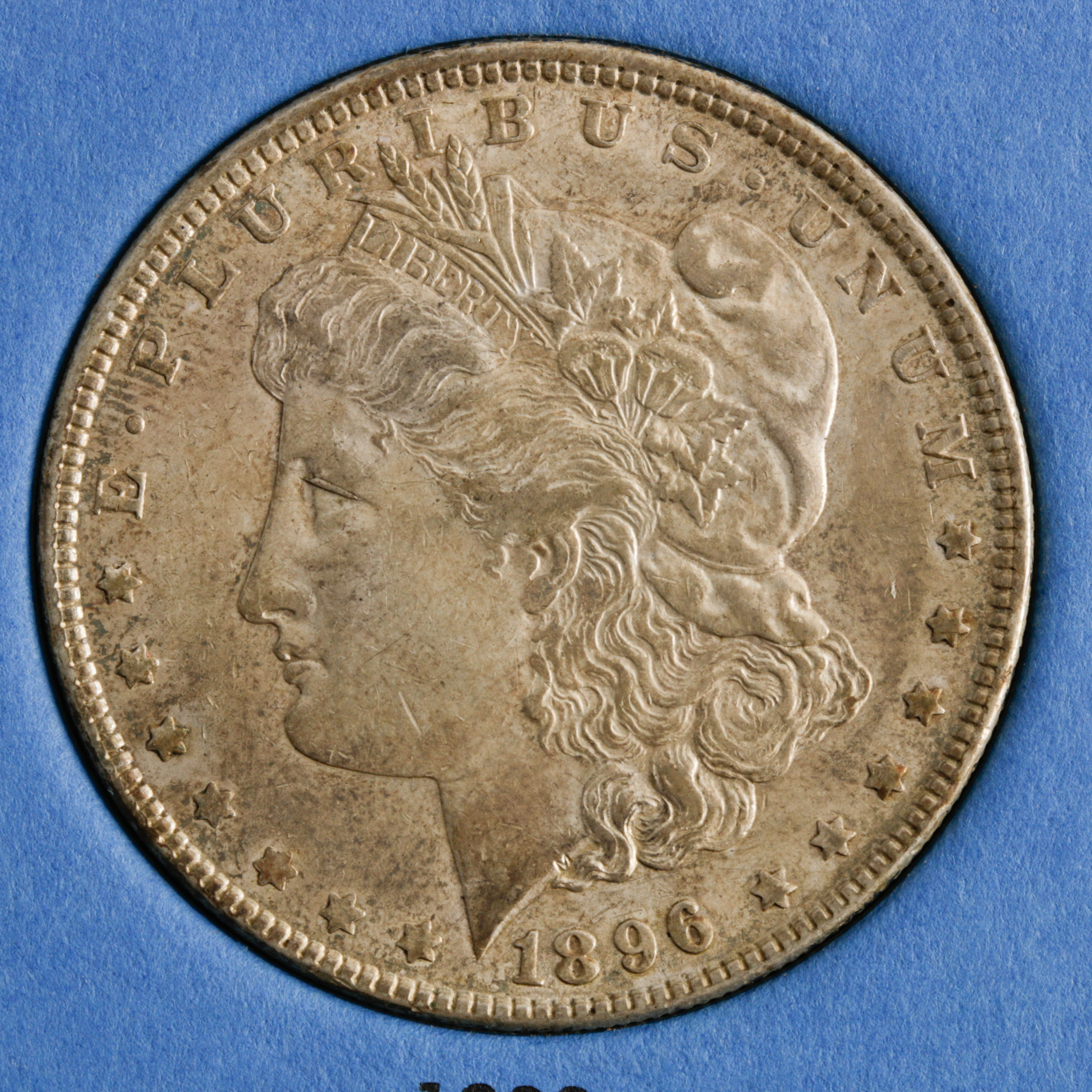 Group of 4 Silver Morgan Dollars in a Whitman Coin Folder Ranging in Age from 1891 to 1896