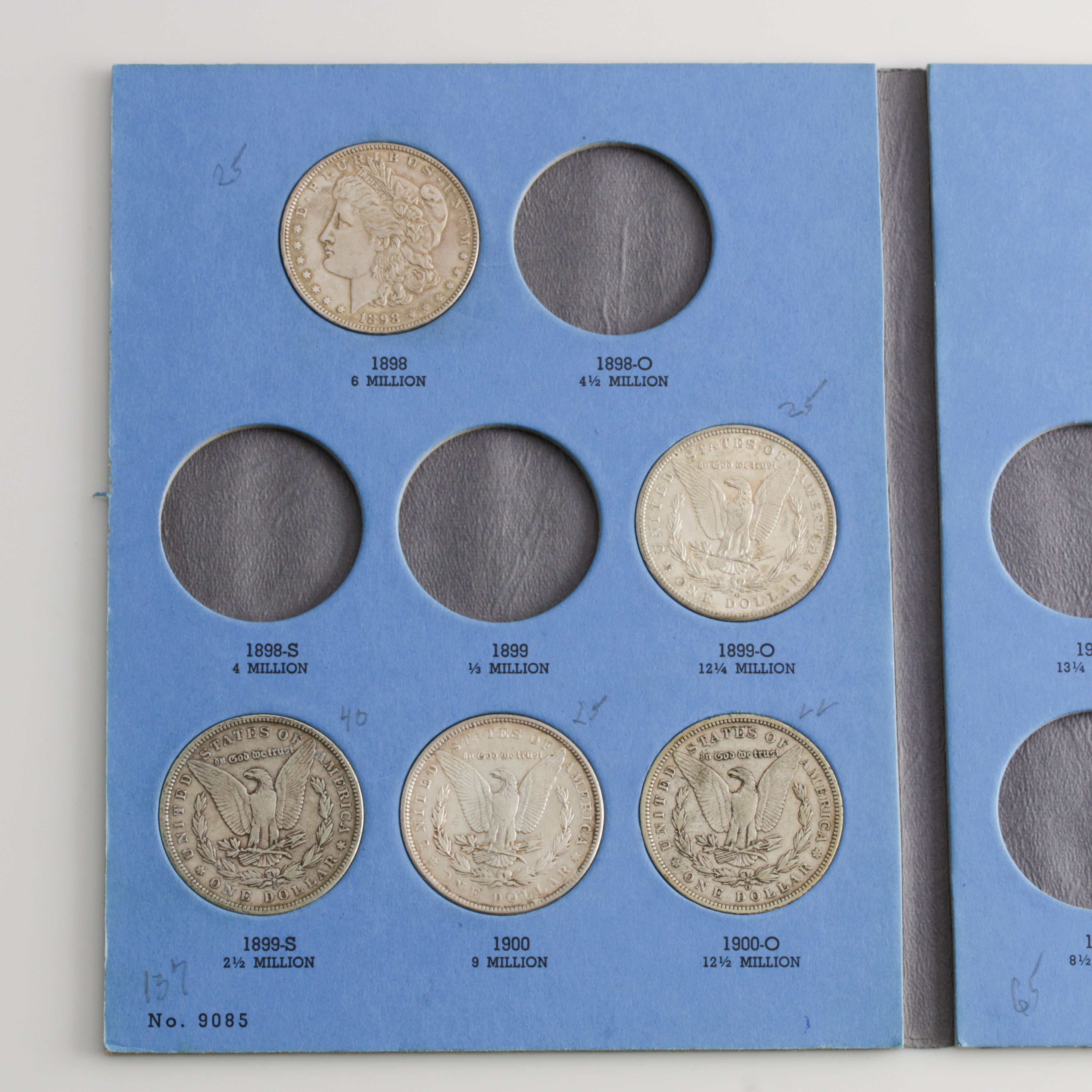 Group of 11 Silver Morgan Dollars in a Whitman Coin Folder Ranging in Age from 1898 to 1921