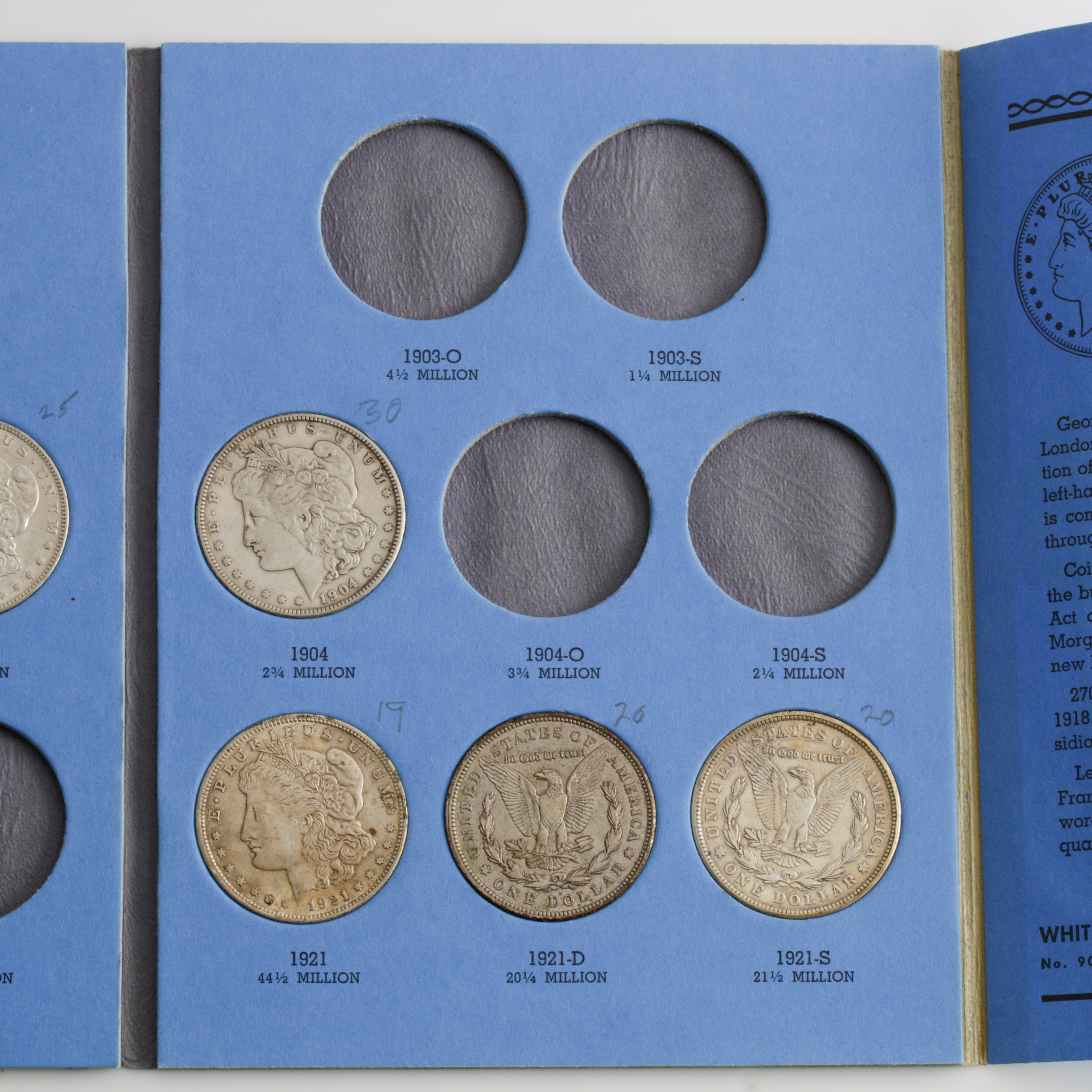 Group of 11 Silver Morgan Dollars in a Whitman Coin Folder Ranging in Age from 1898 to 1921
