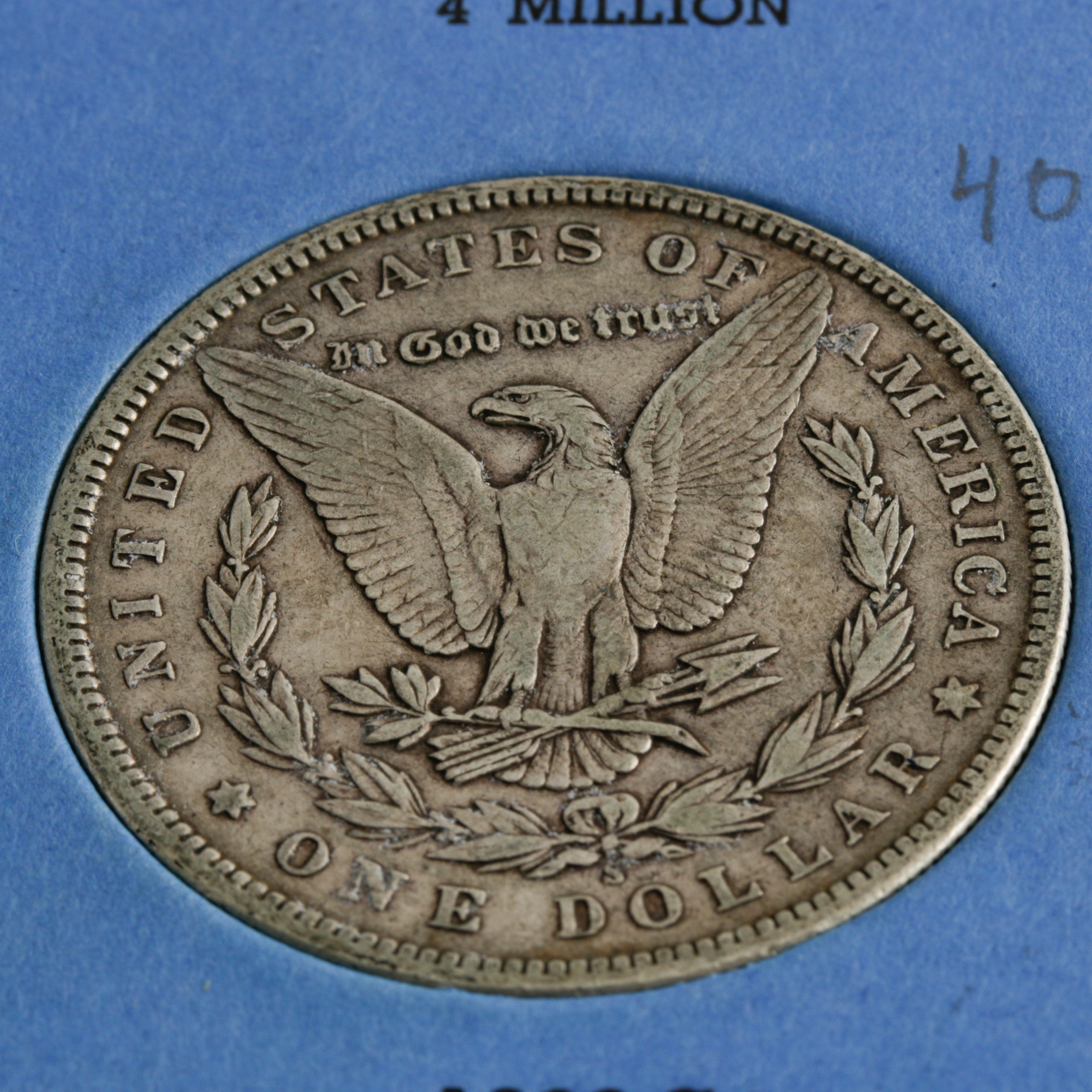 Group of 11 Silver Morgan Dollars in a Whitman Coin Folder Ranging in Age from 1898 to 1921