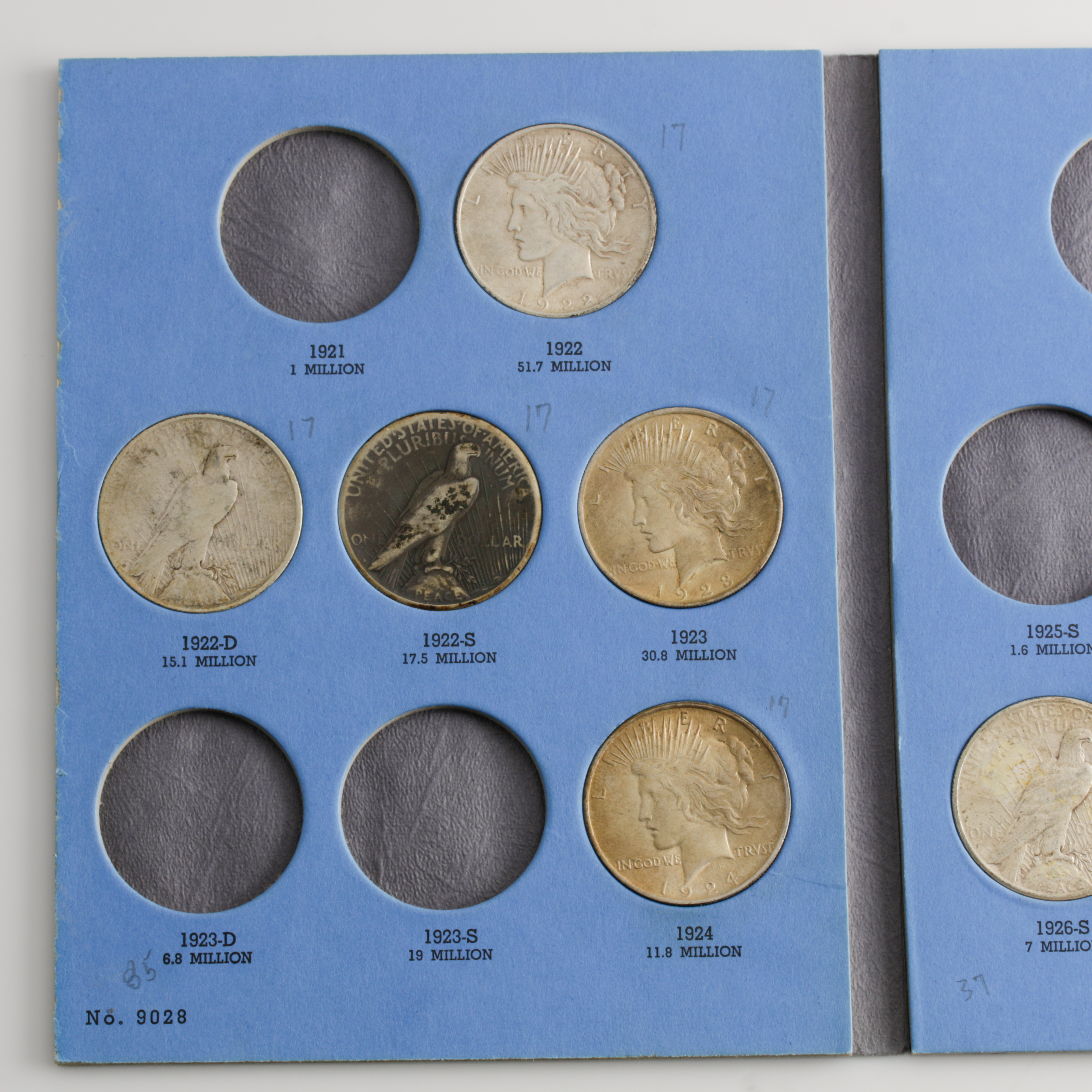 Group of 8 Silver Peace Dollars in a Whitman Coin Folder Ranging in Age from 1922 to 1928