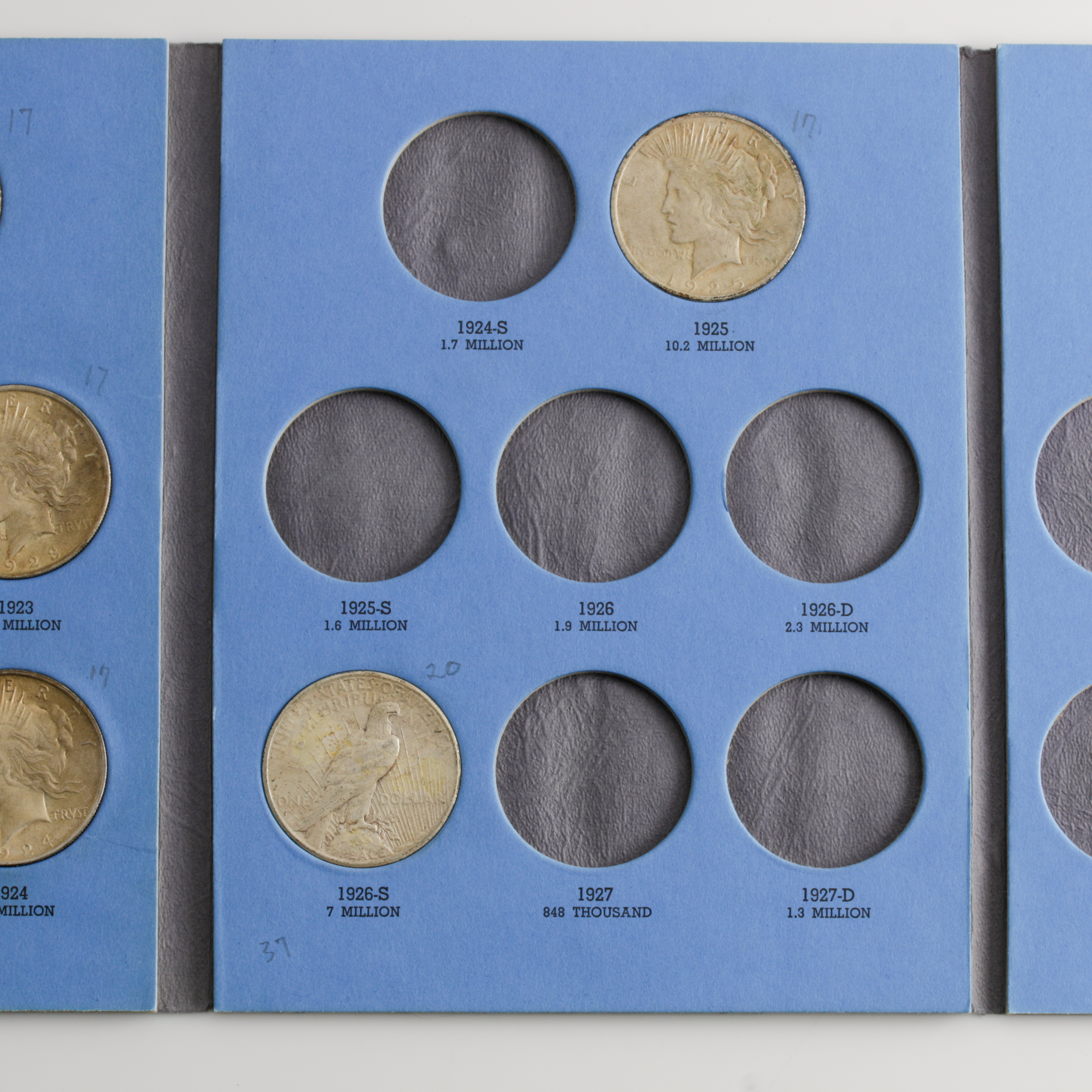 Group of 8 Silver Peace Dollars in a Whitman Coin Folder Ranging in Age from 1922 to 1928