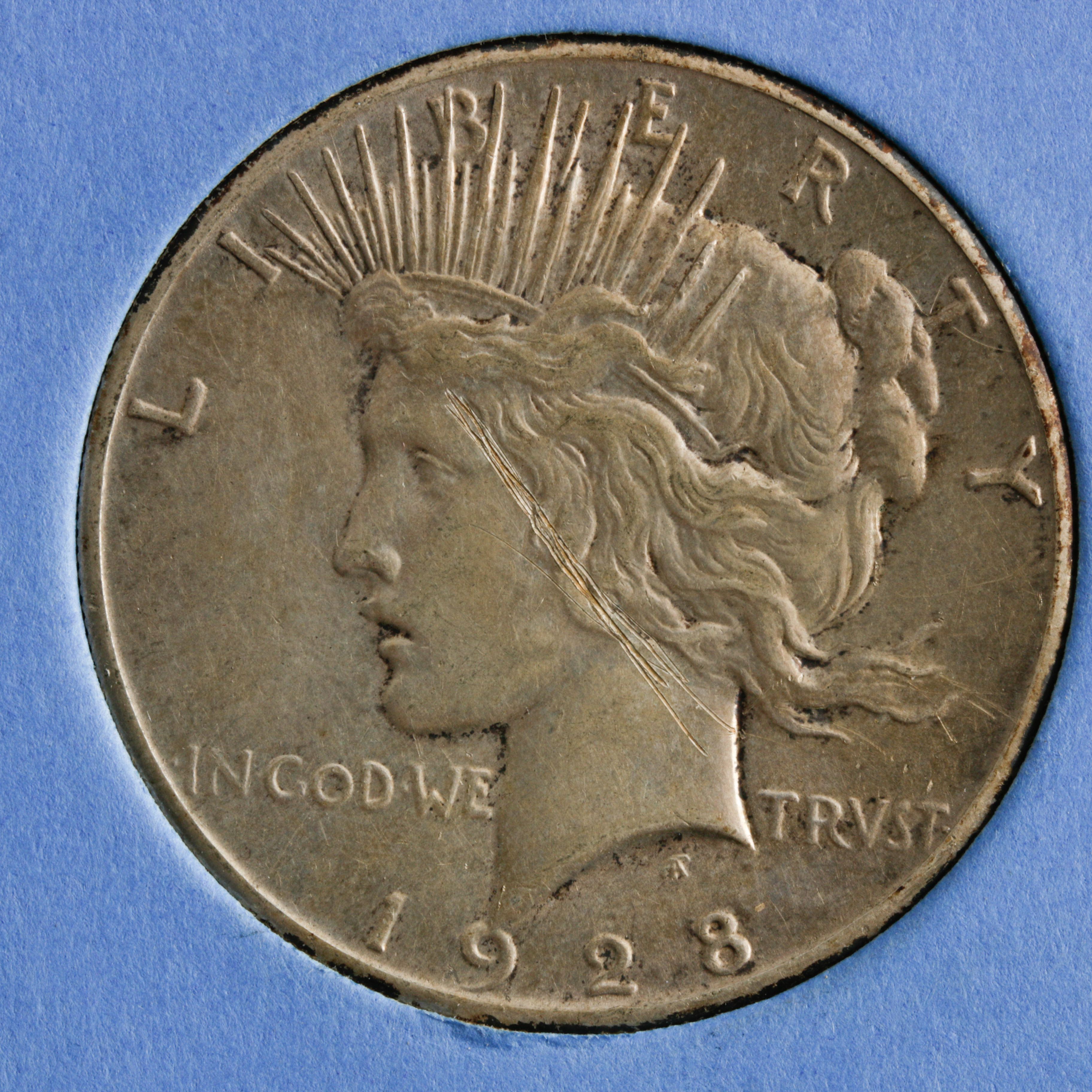 Group of 8 Silver Peace Dollars in a Whitman Coin Folder Ranging in Age from 1922 to 1928