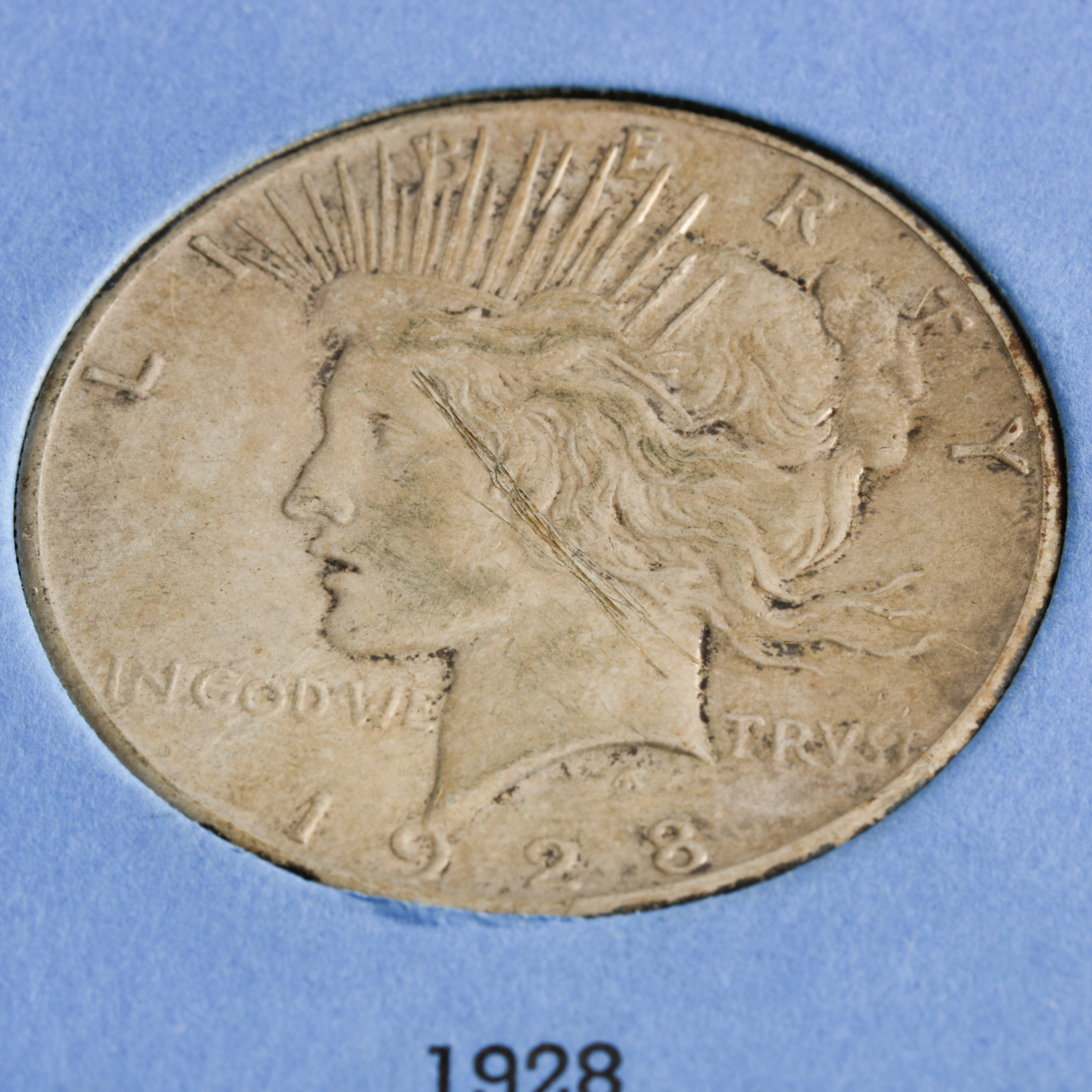 Group of 8 Silver Peace Dollars in a Whitman Coin Folder Ranging in Age from 1922 to 1928