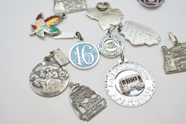 Eleven Sterling Silver Travel Charms and Charm Bracelet