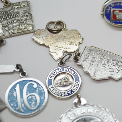 Eleven Sterling Silver Travel Charms and Charm Bracelet