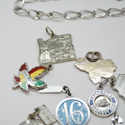 Eleven Sterling Silver Travel Charms and Charm Bracelet