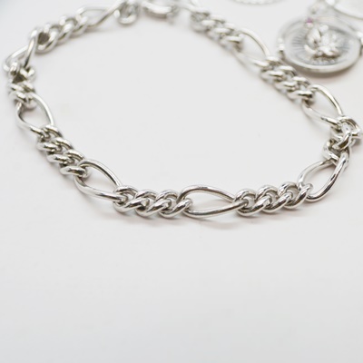 Thirteen Sterling Silver Charms and Charm Bracelet