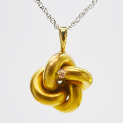 Victorian 14K Yellow Gold Diamond Love Knot Pendant on a Modern 14K White Gold Chain