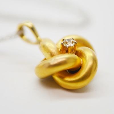 Victorian 14K Yellow Gold Diamond Love Knot Pendant on a Modern 14K White Gold Chain