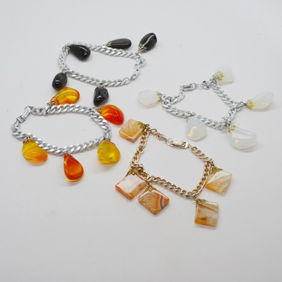 Four Metal Bracelets With Stone Dangles