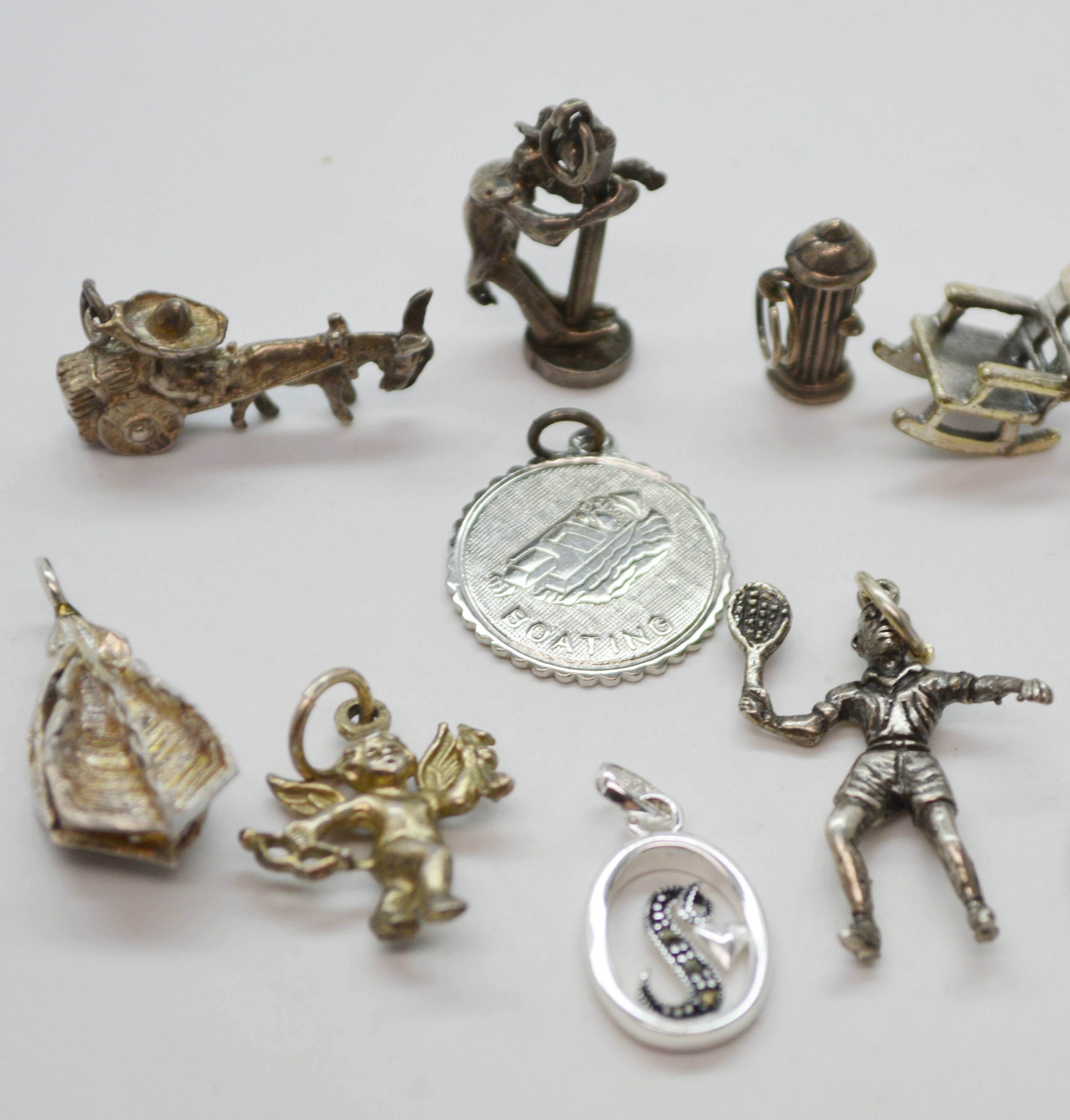 Twelve Sterling Silver Charms
