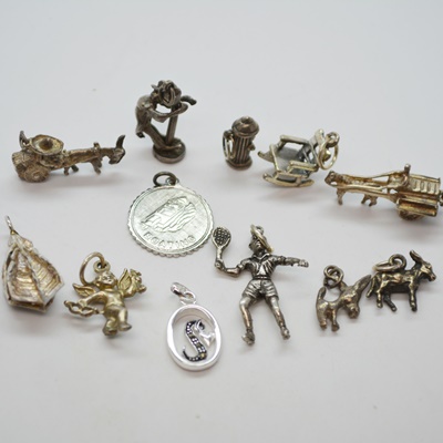 Twelve Sterling Silver Charms