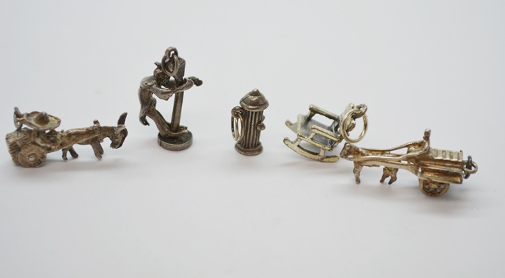 Twelve Sterling Silver Charms